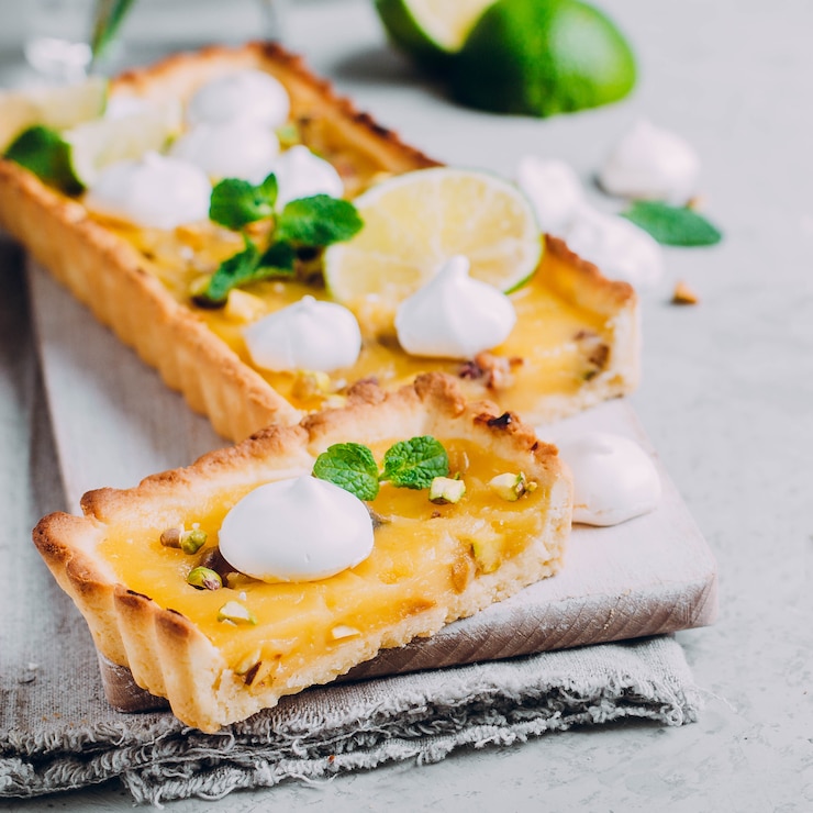 tart-with-lime-lemon-curd-nut-pistachios-meringue-citrus-cake_72608-752